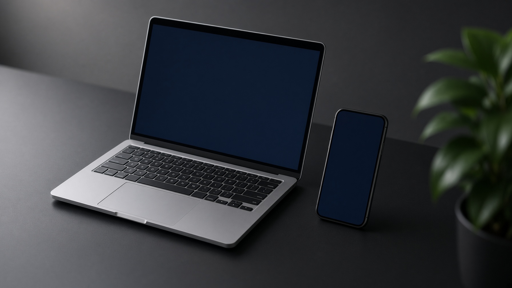 Laptop and phone used for software development at MKSAnalytIQ